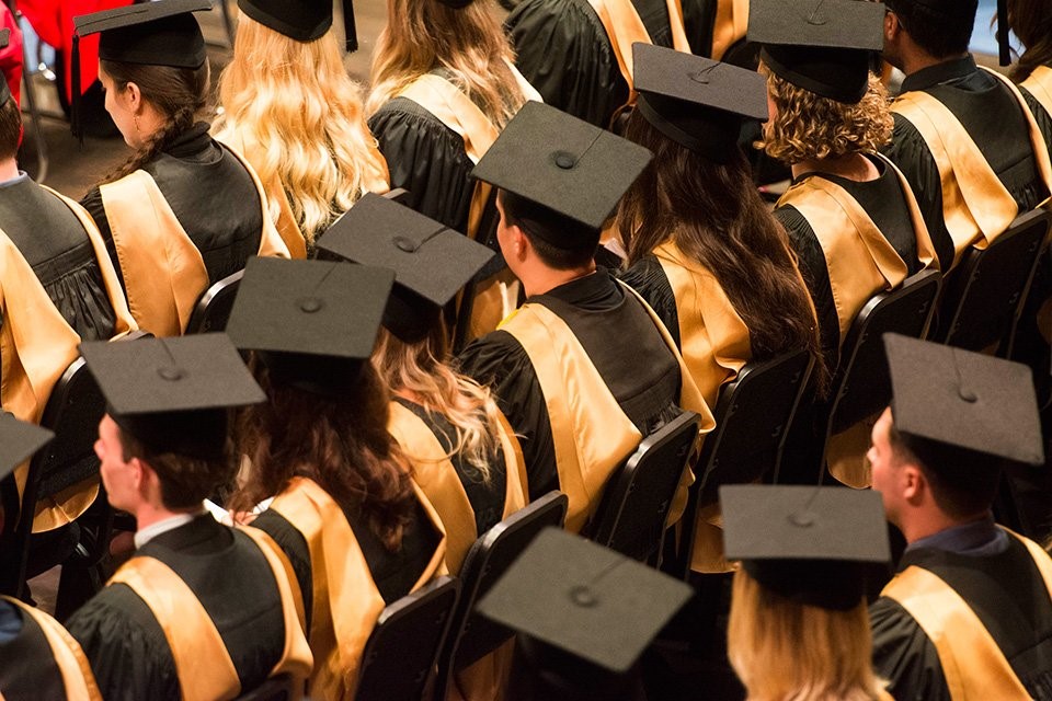 graduates in cap and gown