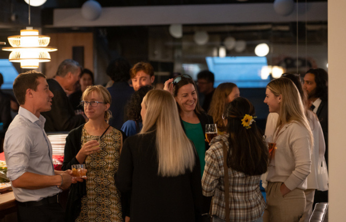 people networking at a bar