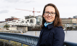 Katya Rhodes photographed in front of the Blue Bridge in downtown Victoria