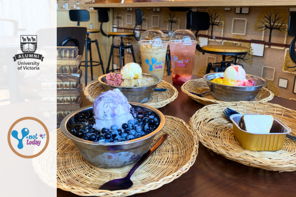 A table with a spread of desserts and drinks with a slightly trasparent white banner on the left side with the Y Not Today and UVic Alumni logos.