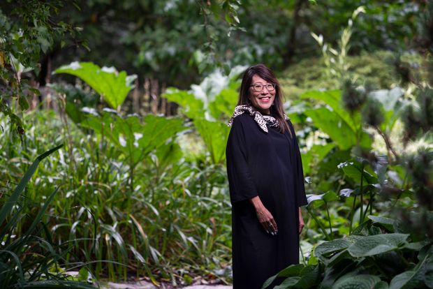 Photo of Karen Kobayashi standing among trees