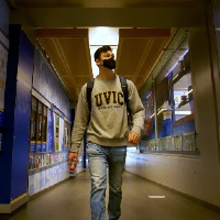 Devin walks down hallway in CARSA